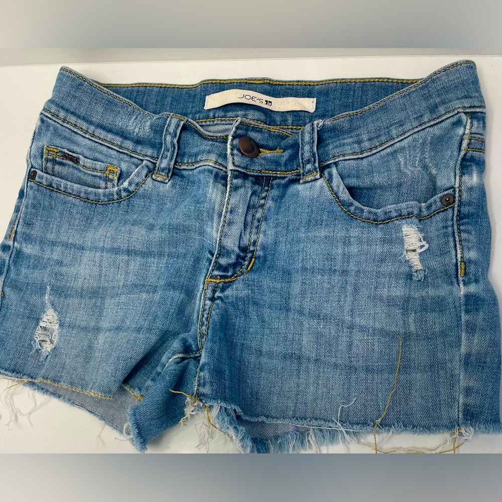 Stylish girl shorts with rips, perfect for summer ☀️